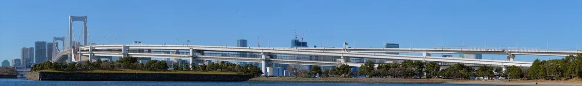 Rainbow Bridge over Tokyo Bay seen from Odaiba on the Tokyo Bay go-kart tour route in Koto City, Tokyo, Japan